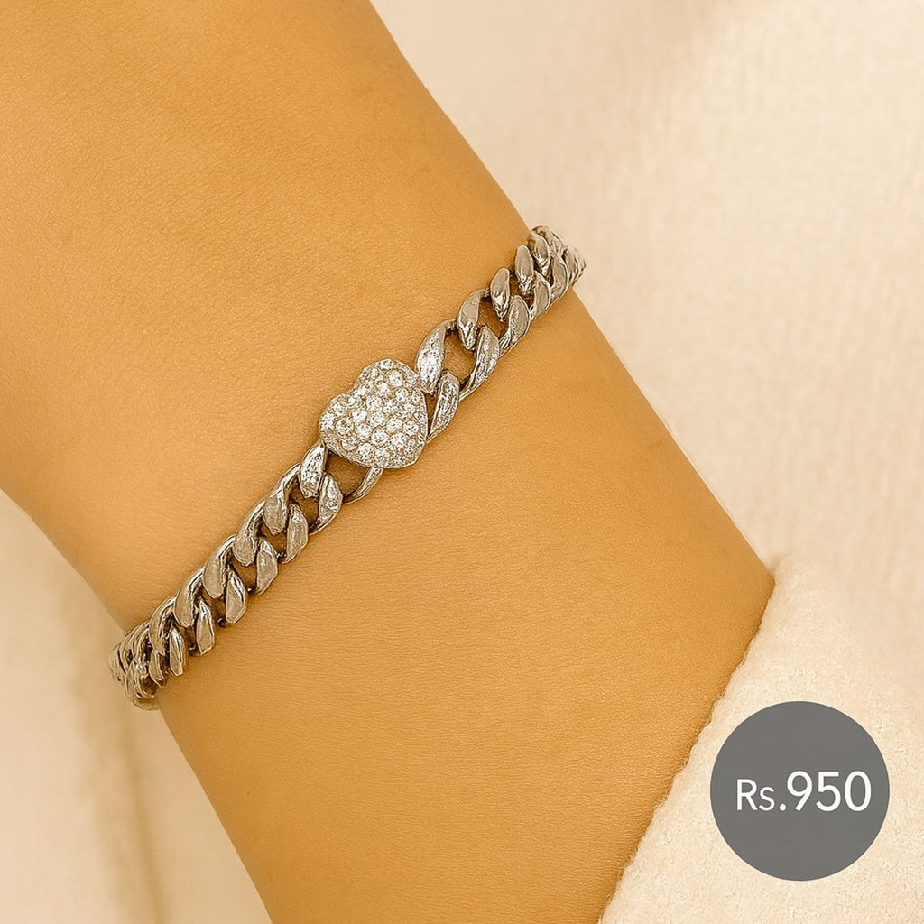 Silver-tone link bracelet with crystal heart charm on wrist – Destiny.pk