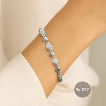 Silver-tone teardrop CZ stone tennis bracelet on model wrist – Destiny.pk