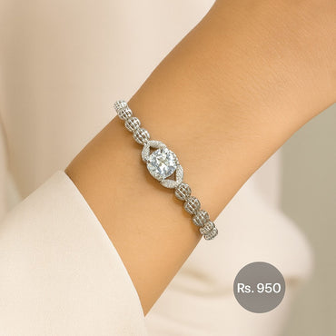 Silver-tone beaded bracelet with solitaire CZ centerpiece on model wrist – Destiny.pk.