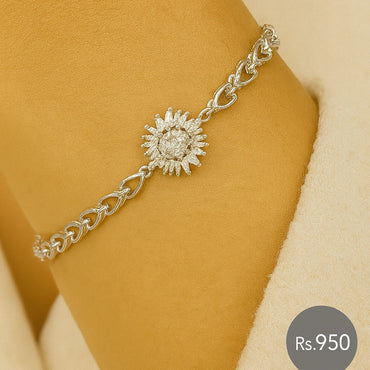 Silver-tone bracelet with sunburst CZ centerpiece on model wrist – Destiny.pk