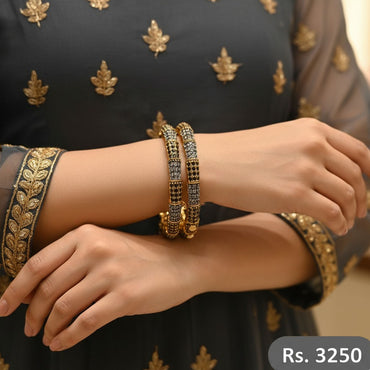 Gold and black crystal bangles set of 2 with elegant finish.