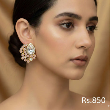Gold-plated stud earrings with ruby, emerald, and sapphire-toned Kundan stones, priced at Rs. 850