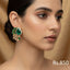 Gold-plated stud earrings with ruby, emerald, and sapphire-toned Kundan stones, priced at Rs. 850