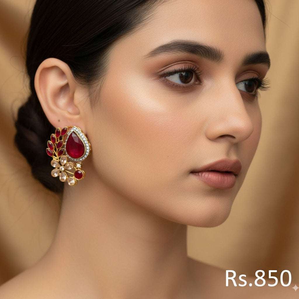Gold-plated stud earrings with ruby, emerald, and sapphire-toned Kundan stones, priced at Rs. 850