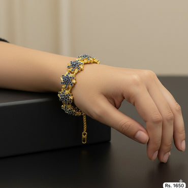 Gold-plated floral bracelet with sparkling stones, priced Rs. 1650