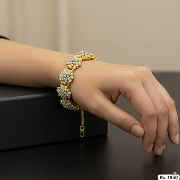 Gold-plated floral bracelet with sparkling stones, priced Rs. 1650