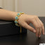 Gold-plated floral bracelet with sparkling stones, priced Rs. 1650