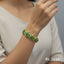 Gold-plated floral bracelet with sparkling stones, priced Rs. 1650