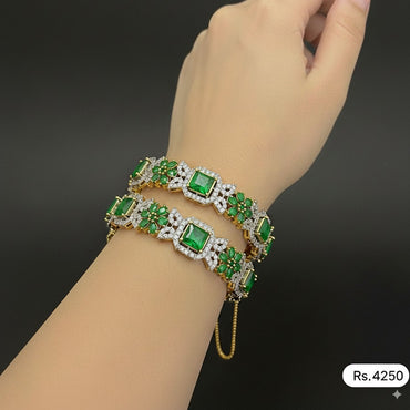 Gold-plated stone-studded bracelet pair with square-cut centerpiece stones, priced Rs. 4250