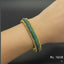Dual-tone gold and silver stone bracelet on hand, priced Rs. 1650