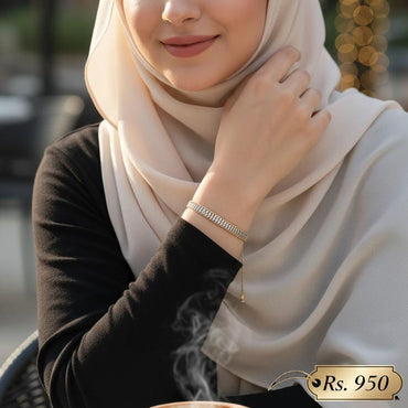 Stainless steel stone-studded bracelet with elegant design, priced Rs. 950