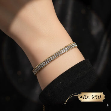 Stainless steel stone-studded bracelet with elegant design, priced Rs. 950