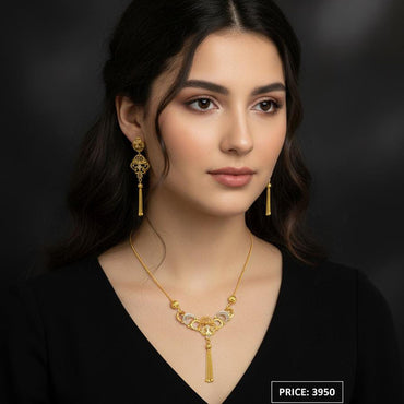 Ornate gold-plated necklace with matching dangle earrings, priced Rs. 3950