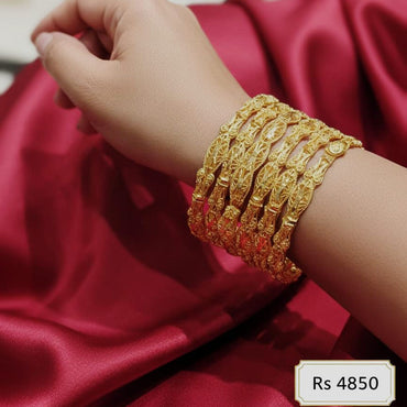 Ethnic gold-plated kada bracelets set of 6 with intricate detailing, priced Rs. 4850
