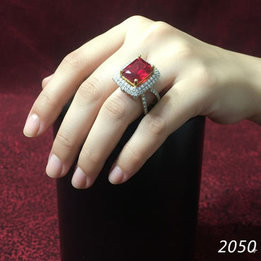 Statement cocktail ring with red crystal centerpiece and pave setting, priced Rs. 2050