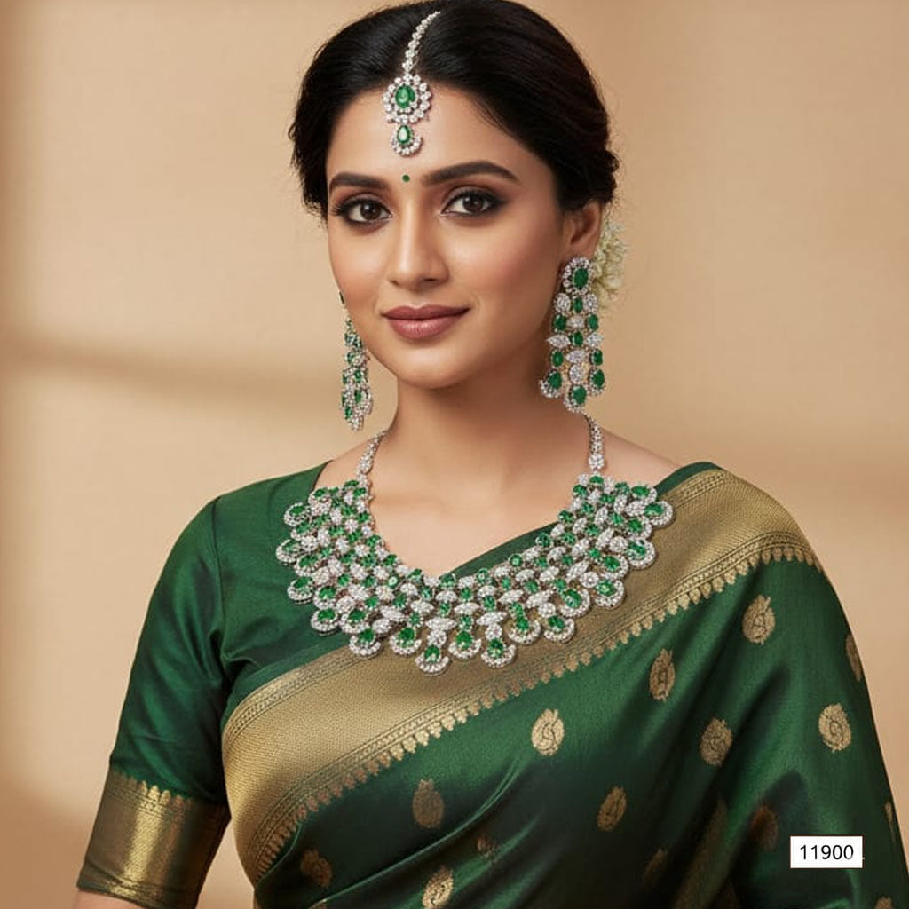 Ornate bridal jewelry set with American Diamonds and stones including necklace, earrings & maang tikka, priced Rs. 11,900