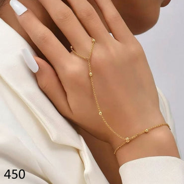 Minimalist hand chain with delicate gold beads for women, priced Rs. 450