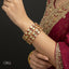 The Royal Kundan Bangle Stack with gold plating and Kundan stones, priced Rs. 4850