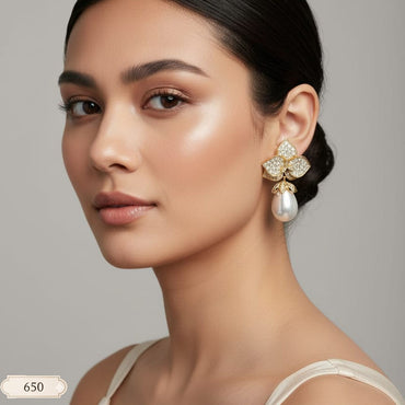 Gilded Garden Earrings with gold-tone floral design and pearl drops, priced Rs. 650