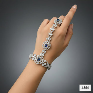 Designer hand bracelet with ring, studded with cubic zirconia stones, priced Rs. 4850