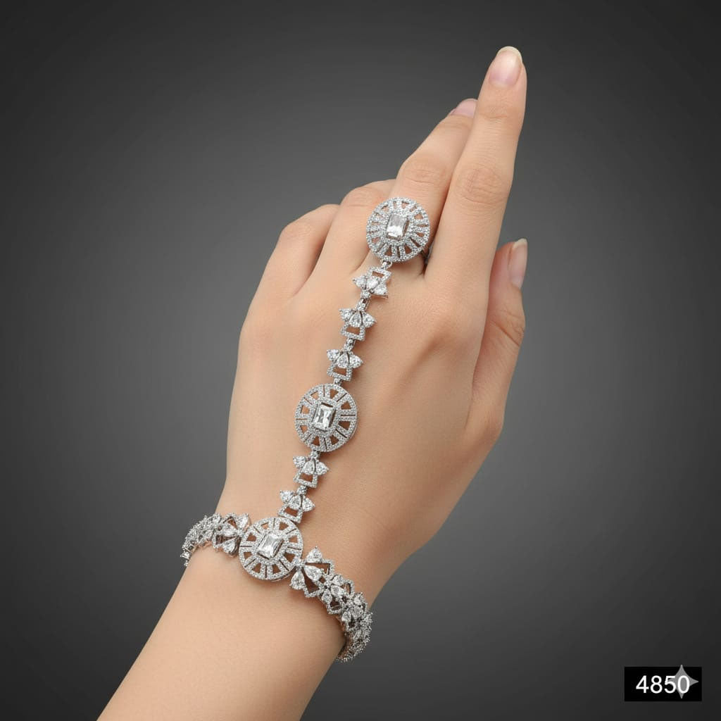 Designer hand bracelet with ring, studded with cubic zirconia stones, priced Rs. 4850