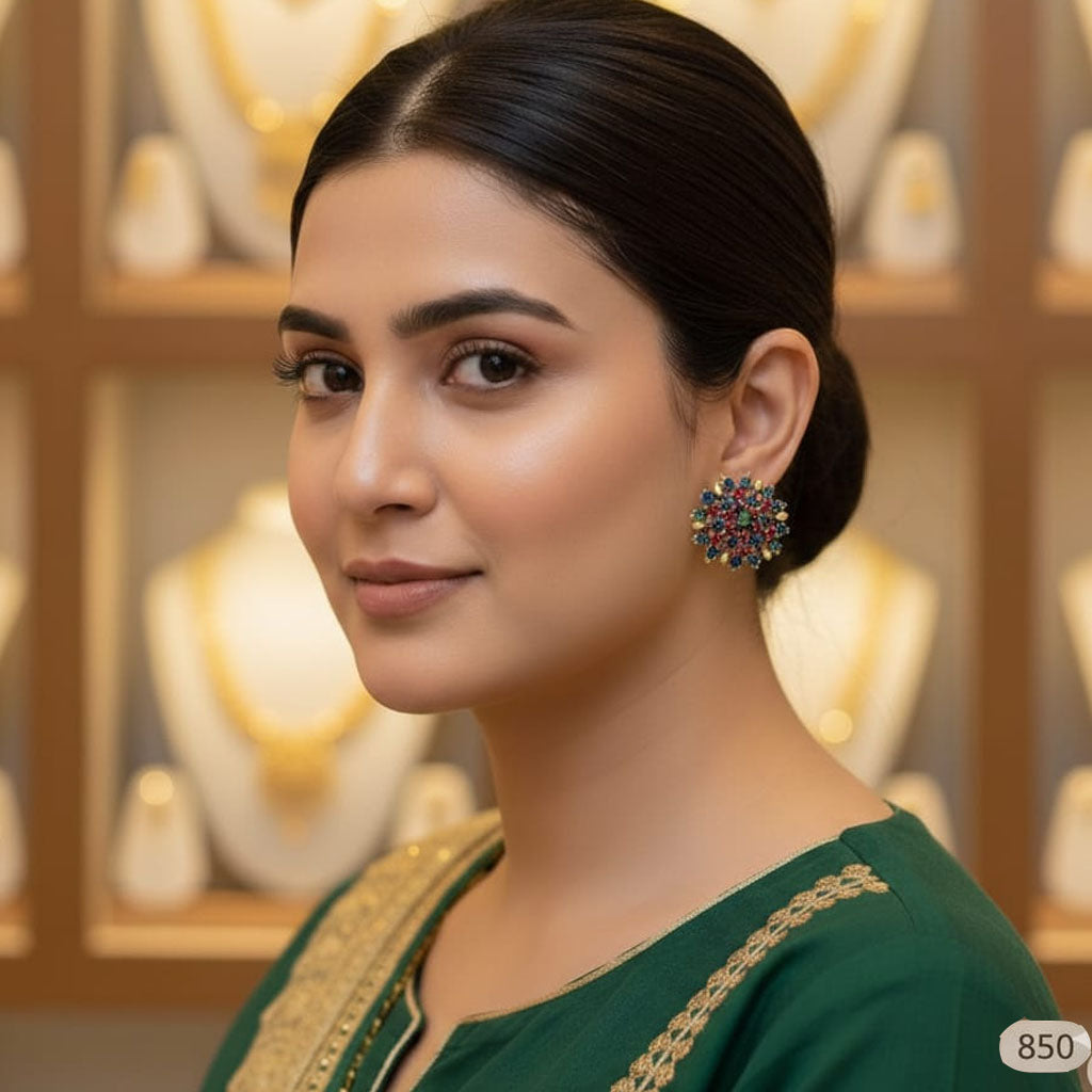 Small ruby and emerald stud earrings with gold plating, priced Rs. 850