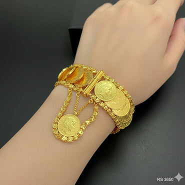 Empress style gold-plated coin bracelet with vintage-inspired motifs, priced Rs. 3650