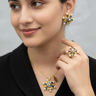 Designer gold-tone pearl and gemstone starburst cluster necklace set with matching earrings, priced Rs. 1850