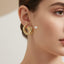 Bold Gold Tone Twisted Croissant Stud Earrings – Rs. 850
