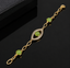 Elegant gold-tone green stone link bracelet with crystal-detailed eye-shaped centerpiece