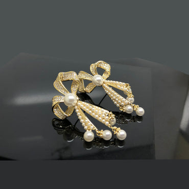 Gold-Tone Bow and Pearl Drop Earring