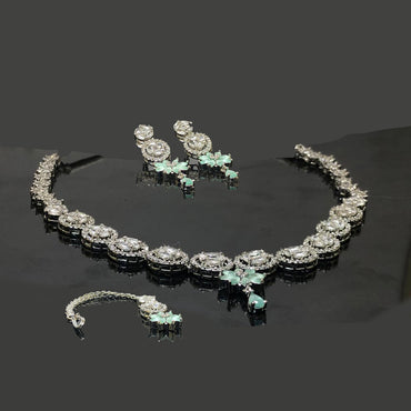 Silver Mint Green Floral Necklace Set with Earrings & Maang Tikka – Rs. 4250