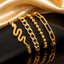 Gold Charm Bracelet Set – 4 Pcs featuring snake charm, Cuban link, bead chain, and paperclip chain