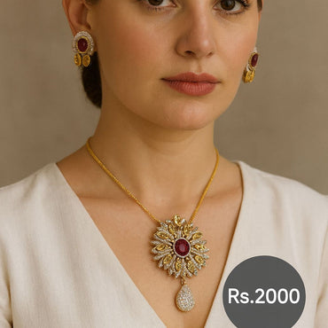 Gold-tone ruby sunburst pendant necklace set with matching earrings on model – Destiny.pk”