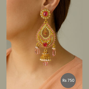 Gold-tone pink kundan jhumka dangler earrings with pearls on model – Destiny.pk”