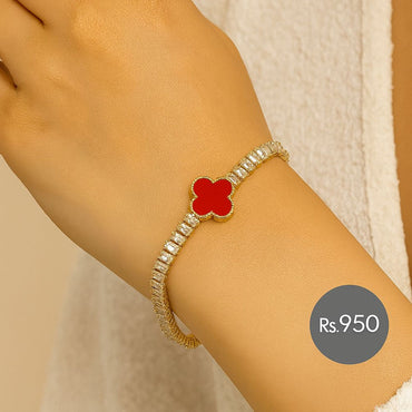 Gold-tone clover tennis bracelet with baguette CZ and white inlay on wrist – Destiny.pk