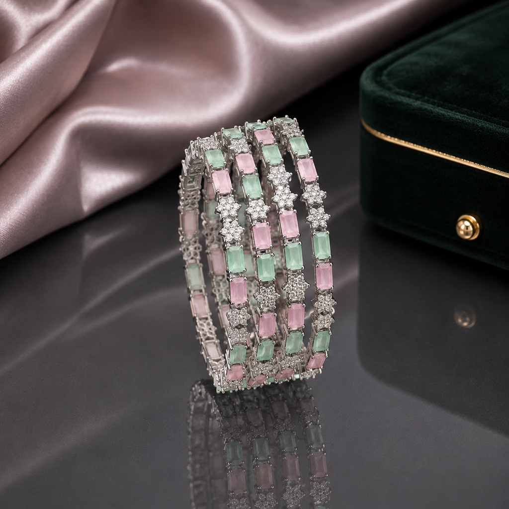Pastel pink and mint green crystal bangles set with floral detailing and silver-tone finish