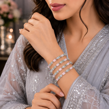 Pastel pink and mint green crystal bangles set with floral detailing and silver-tone finish