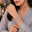 Pastel pink and mint green crystal bangles set with floral detailing and silver-tone finish