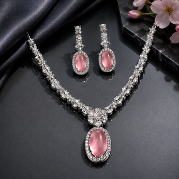 Pink stone American Diamond necklace set with matching drop earrings in silver tone
