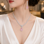 Pink stone American Diamond necklace set with matching drop earrings in silver tone