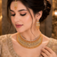 Golden American Diamond bridal choker set with matching earrings and long statement pendant