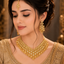 Golden American Diamond bridal choker set with matching earrings and maang tikka