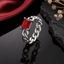 Silver-tone chain link ring with rectangular red stone centerpiece