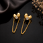 Golden heart-shaped chain drop earrings with sparkling center stones