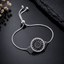 Round crystal adjustable bracelet with colorful stone detailing and silver-tone chain