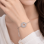 Round crystal adjustable bracelet with colorful stone detailing and silver-tone chain