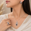 Royal blue sapphire-style AD jewelry set with pearl drop earrings and matching ring