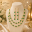 Elegant green emerald-style double-layer necklace set with matching drop earrings