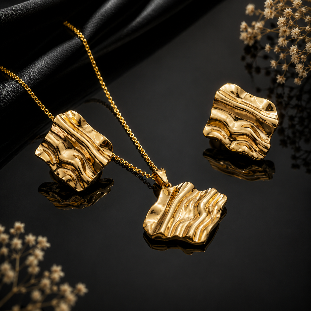 Golden wave textured pendant necklace with matching abstract earrings
